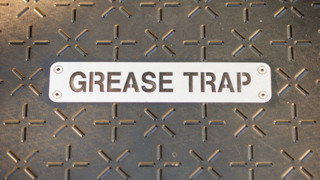 grease trap lid labeled as "grease trap"