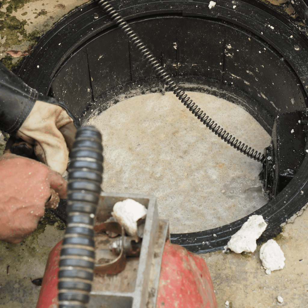 a grease trap being pumped out